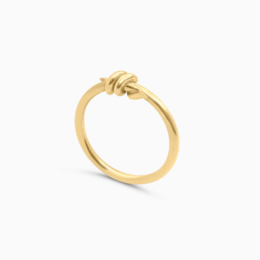 Gold hoop earring on a white background