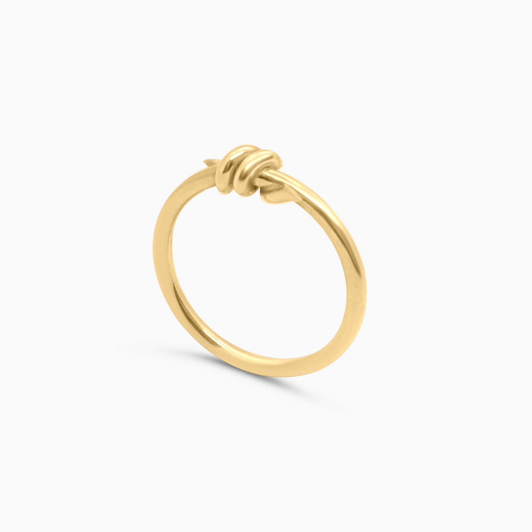 Gold hoop earring on a white background