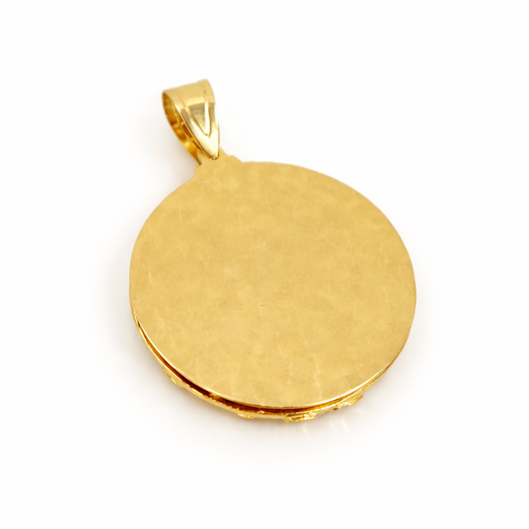 Gold pendant on a white background
