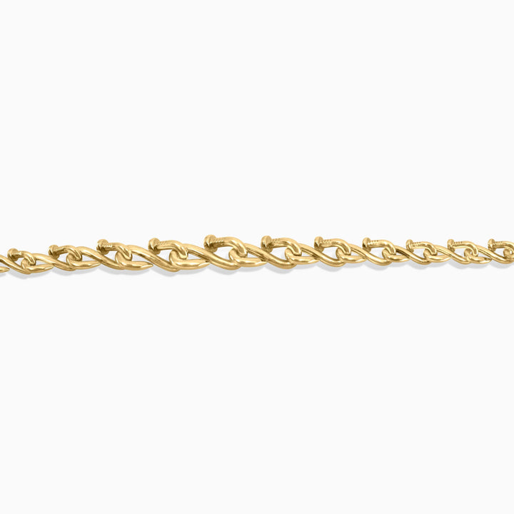 Gold chain bracelet on a white background