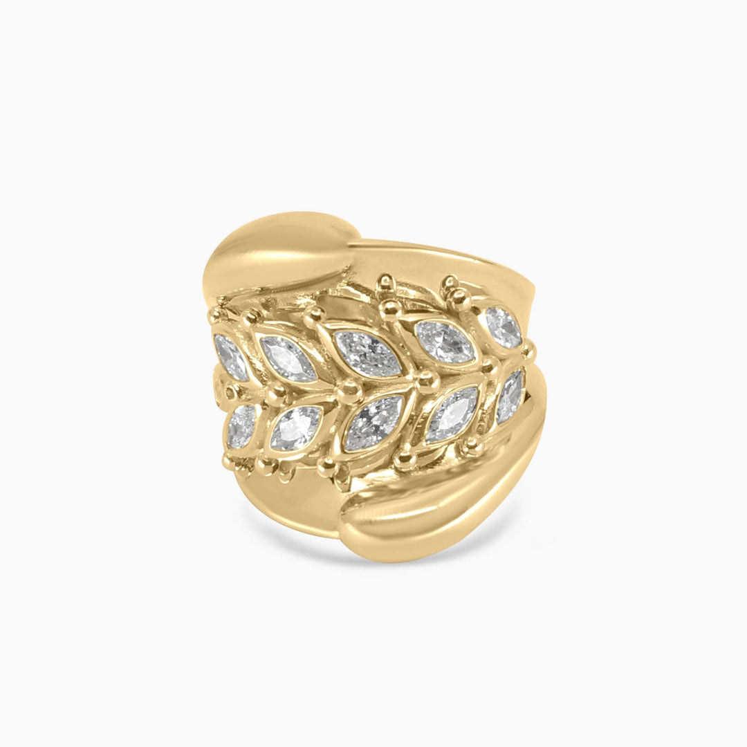 Gold ring with diamond accents on a white background