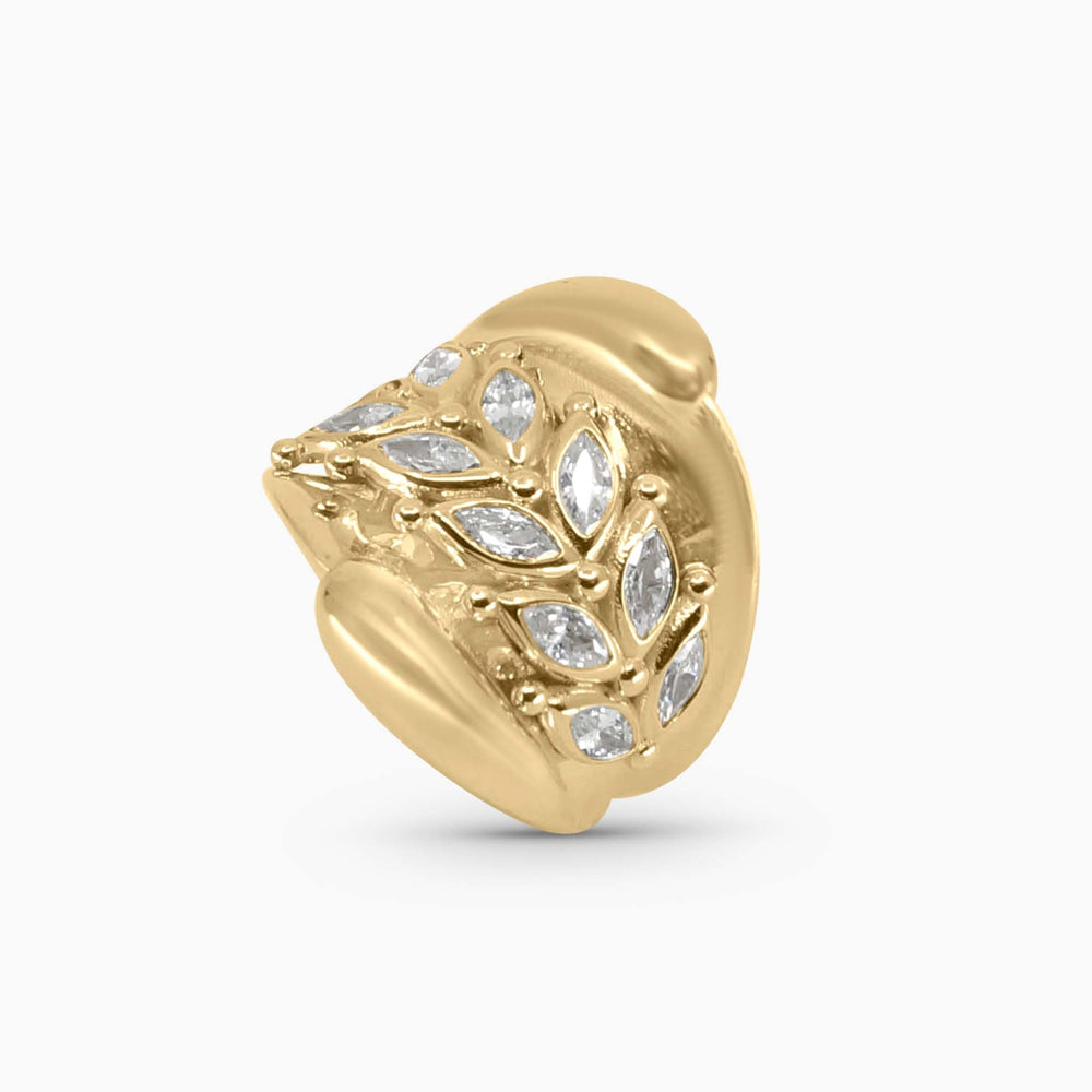 Gold earring with diamond accents on a white background