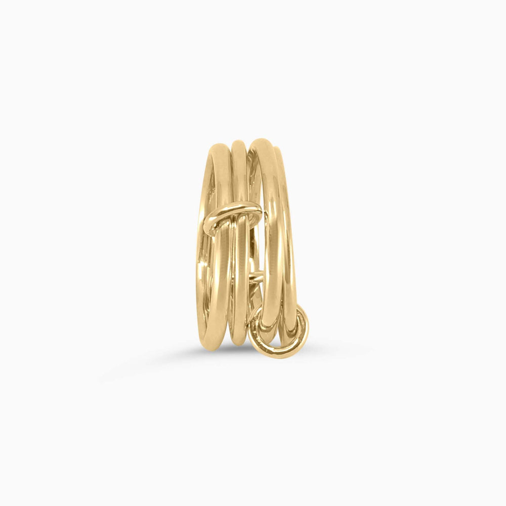 Gold ring with multiple bands on a white background