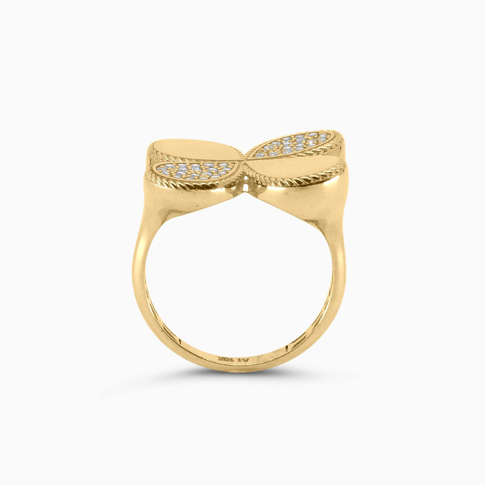 Gold ring with bow design on a white background