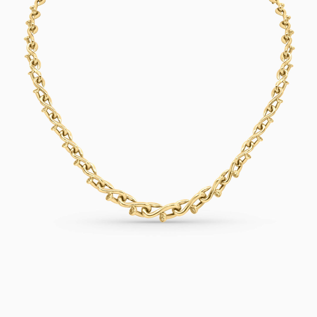 Gold chain necklace on a white background