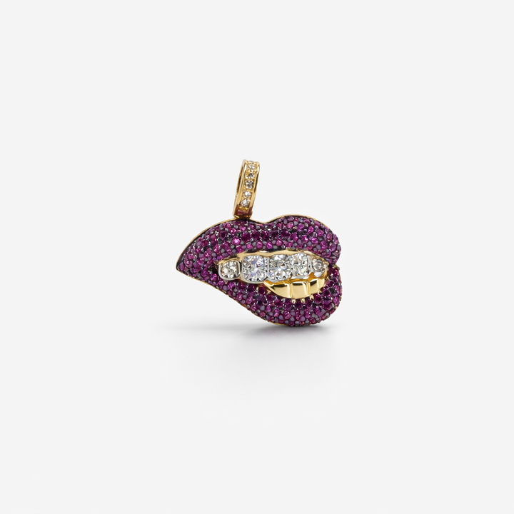Lip-shaped pendant with gemstones and gold accents on a white background