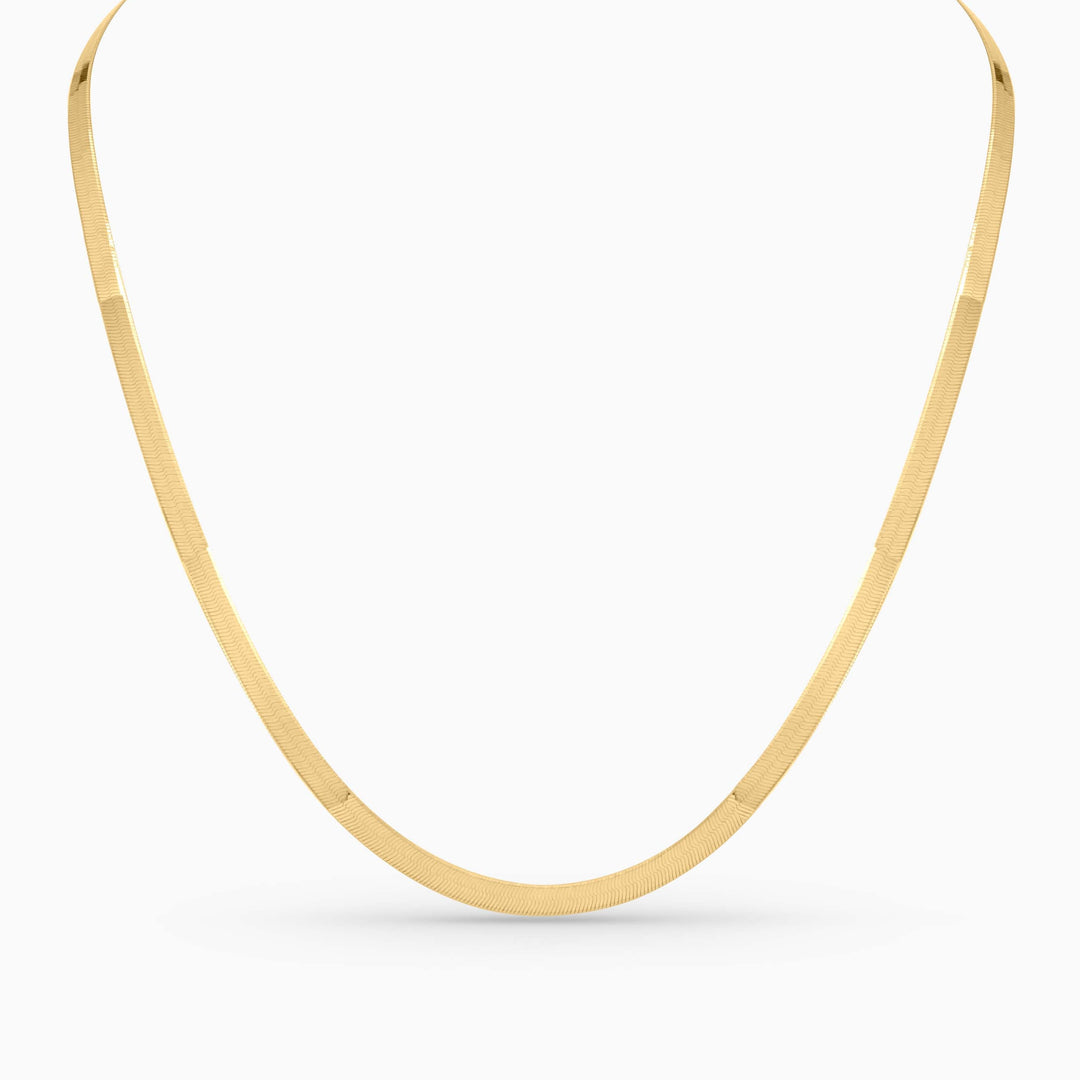 Gold necklace on a white background