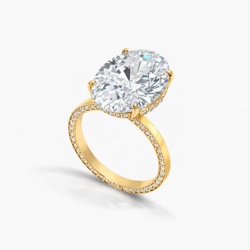 Gold ring with a large diamond on a white background