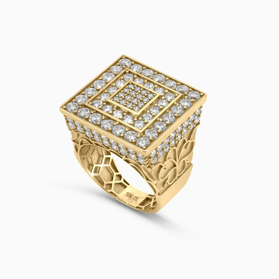 Gold ring with diamond accents on a white background