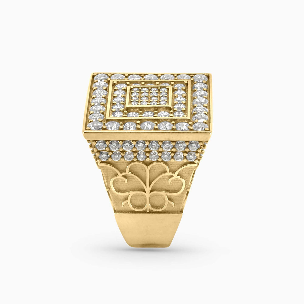 Gold ring with diamond accents on a white background