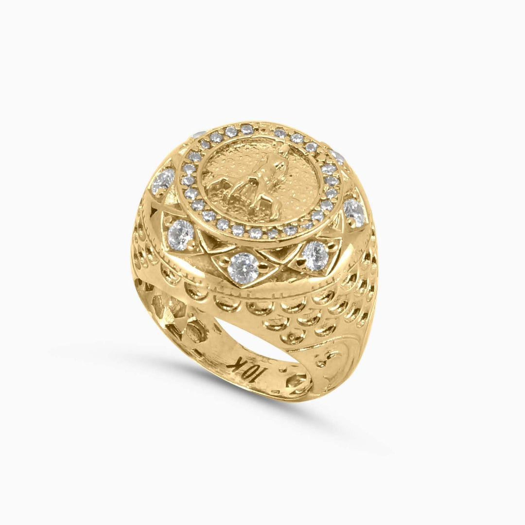 Gold ring with embedded stones on a white background