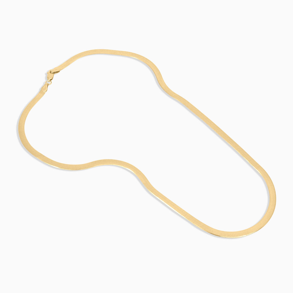 Gold necklace on a white background
