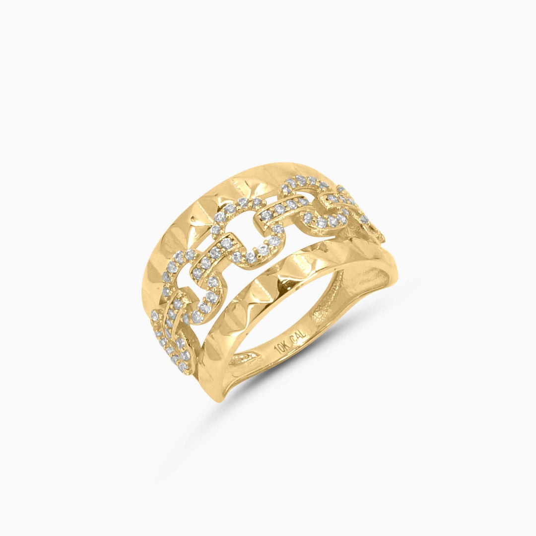 Gold ring with diamond accents on a white background