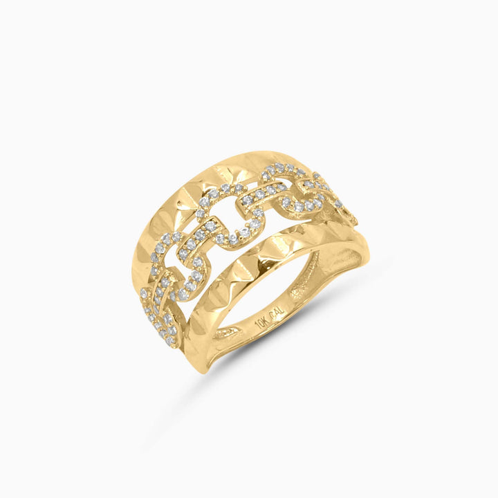 Gold ring with diamond accents on a white background