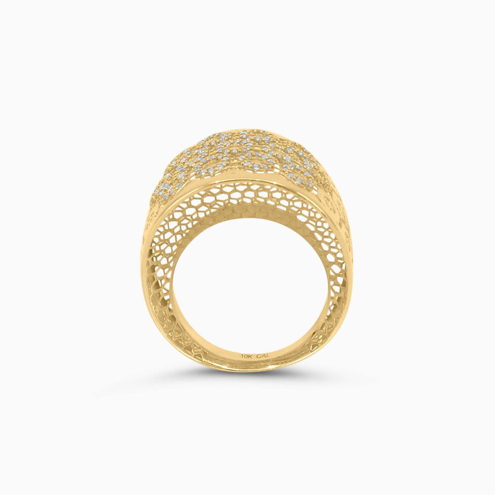 Gold ring with intricate design on a white background