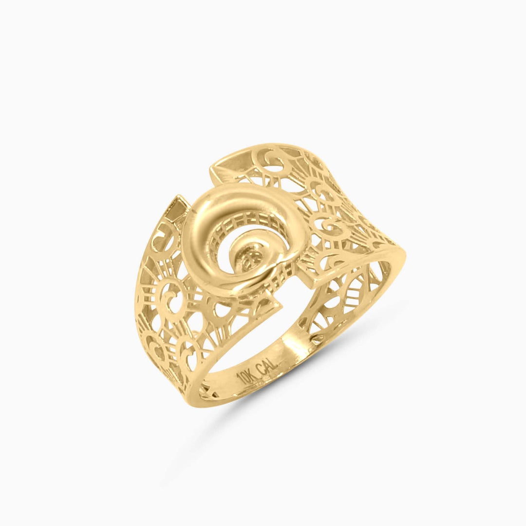 Gold ring with intricate design on a white background