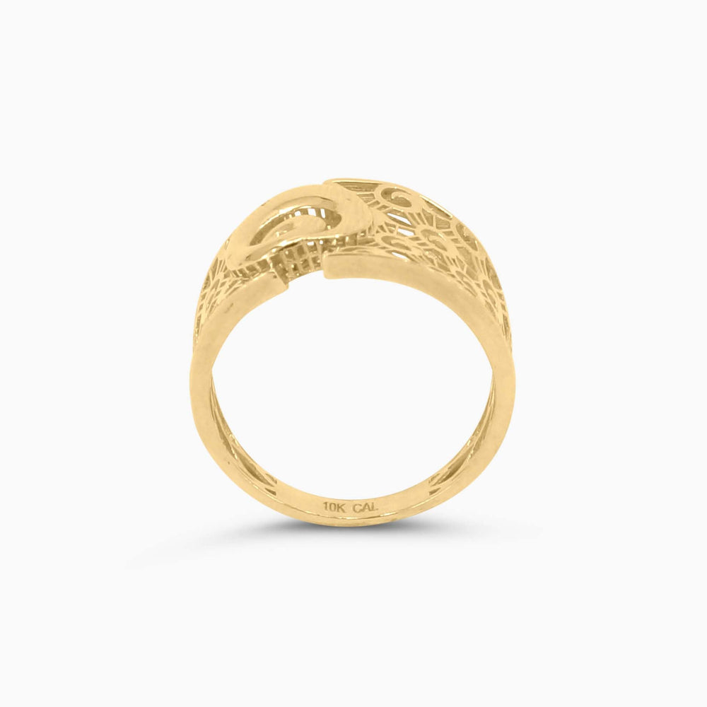 Gold ring with intricate design on a white background
