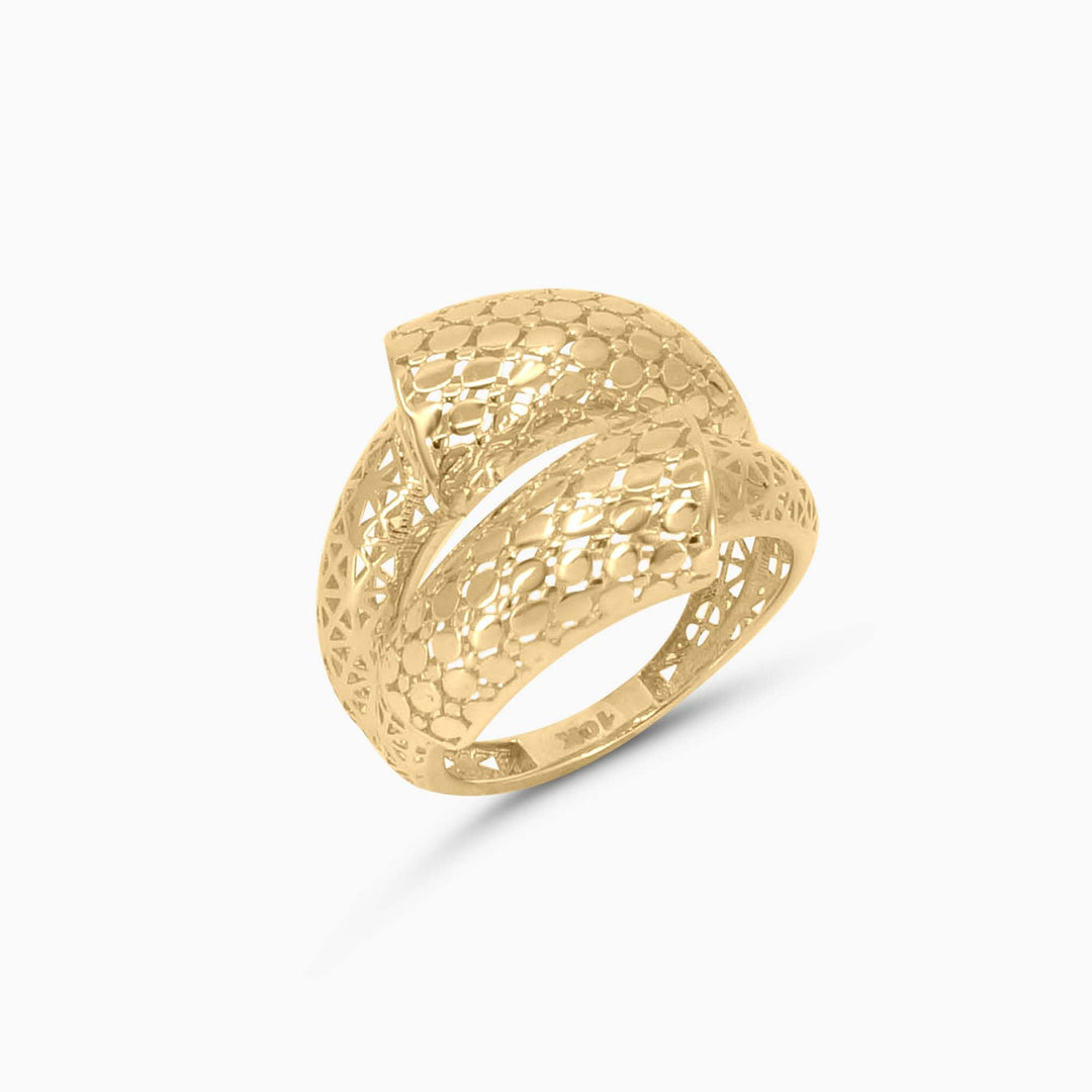 Gold ring with textured design on a white background