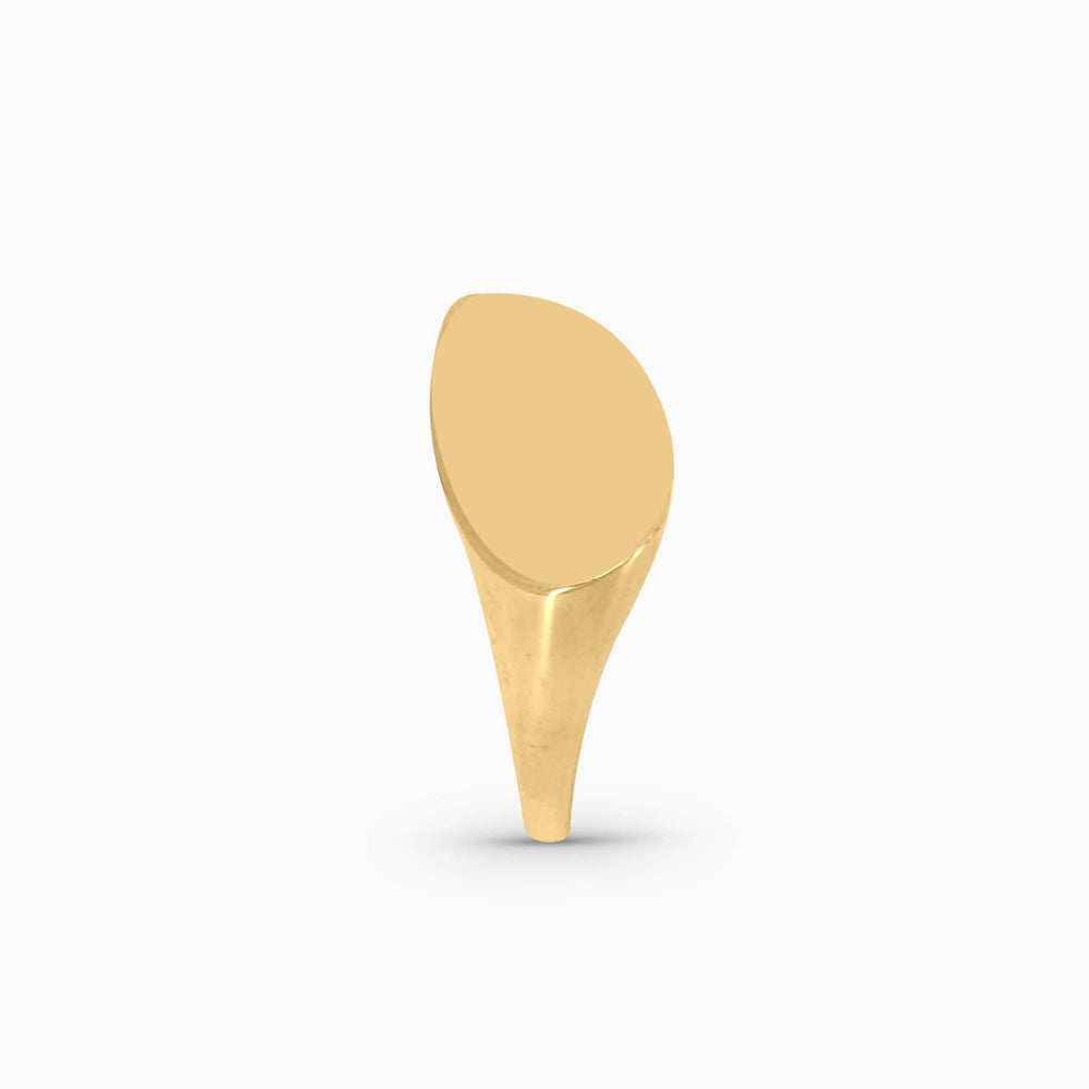 Gold spoon-shaped ring on a white background