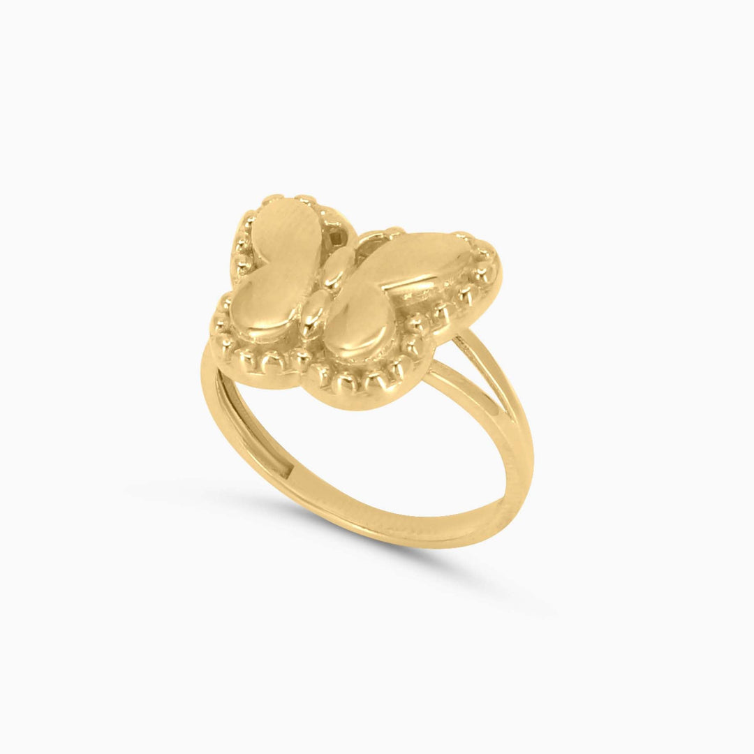 Gold ring with a unique design on a white background