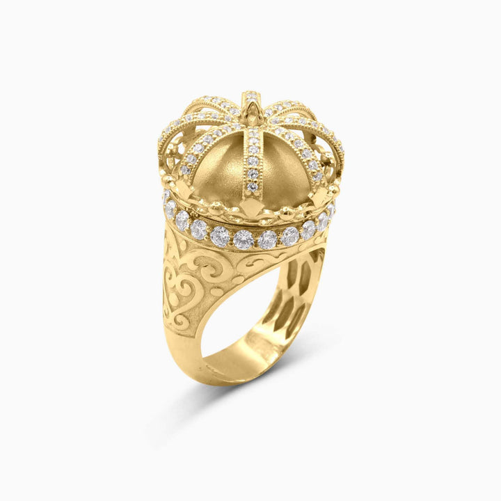 Gold crown-shaped ring with diamond accents on a white background