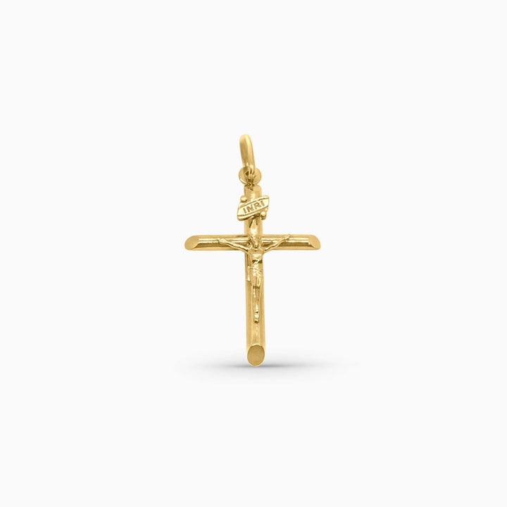 Gold cross pendant on a white background