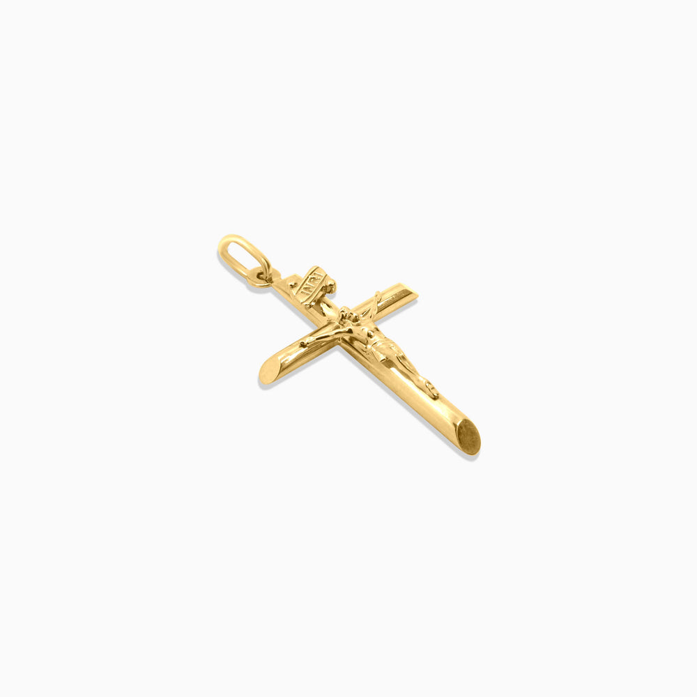 Gold crucifix pendant on a white background