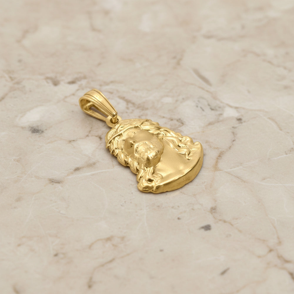 Gold pendant on a white background