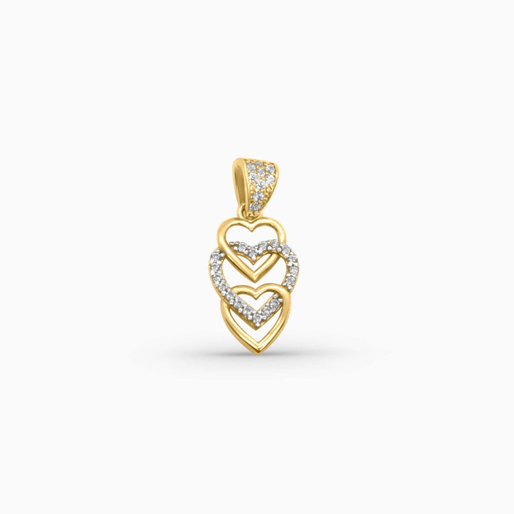 Gold pendant with heart designs on a white background