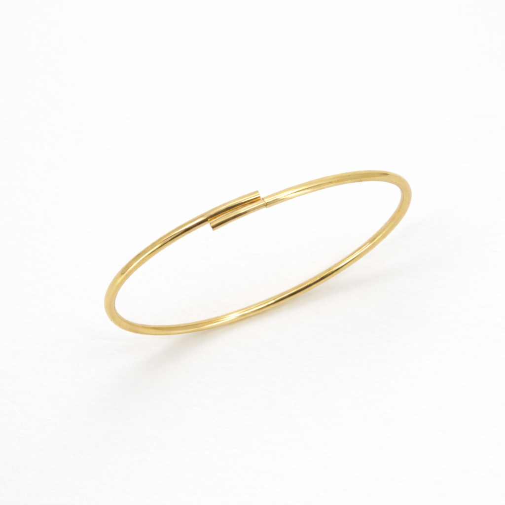 Gold anklet on a white background