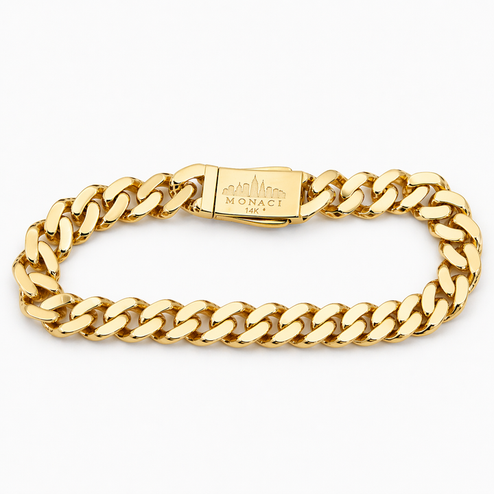 Gold chain bracelet with a visible brand logo on a white background