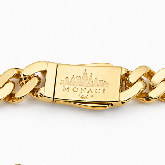 Gold chain bracelet with a visible brand logo on a white background