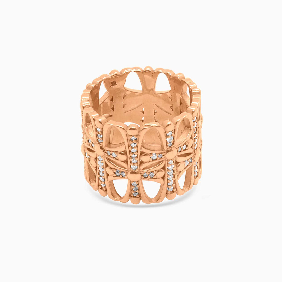 Rose gold ring with intricate design on a white background