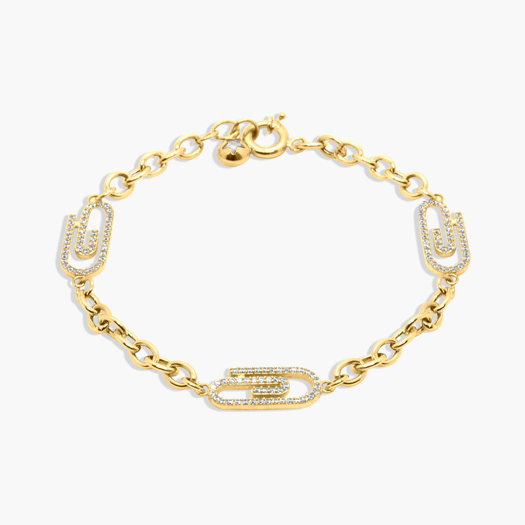 Gold bracelet with diamond accents on a white background
