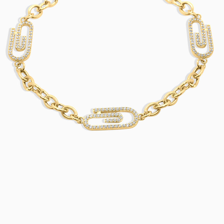Gold chain necklace with unique links on a white background