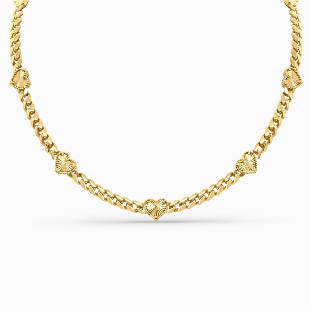 Gold chain necklace on a white background