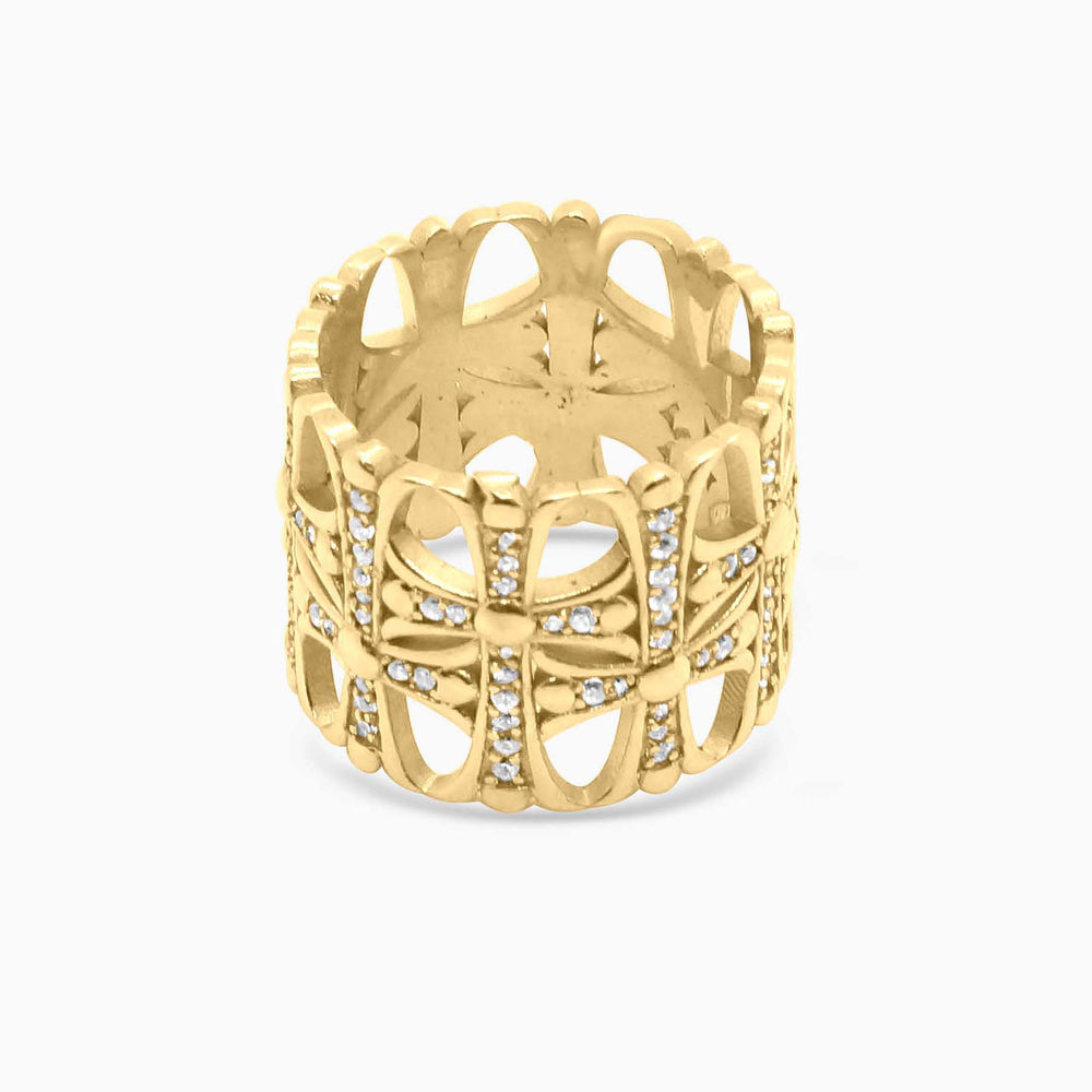 Gold ring with intricate design on a white background