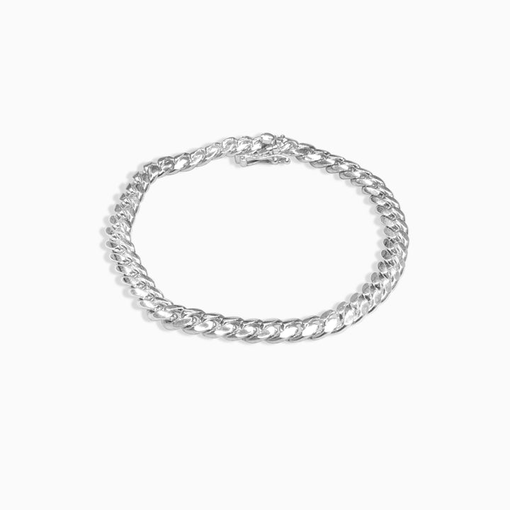 Silver chain bracelet on a white background