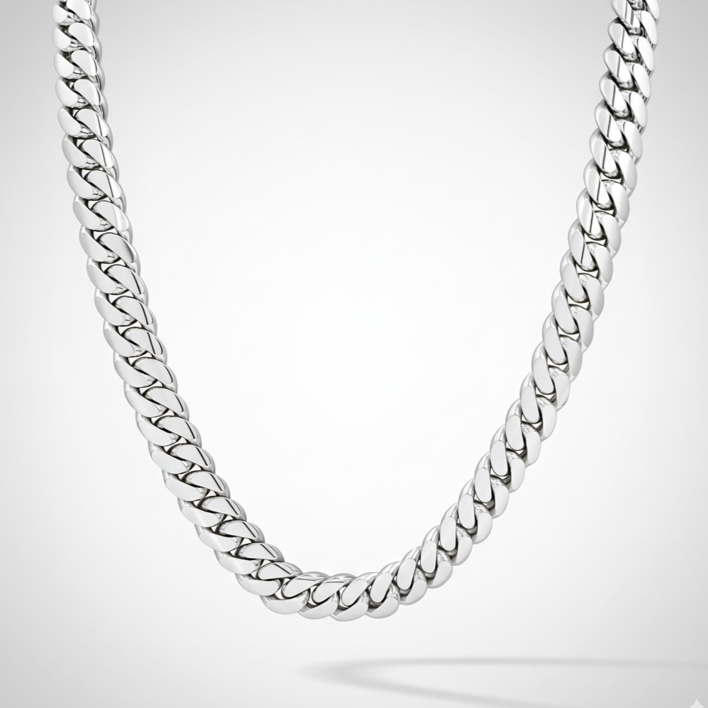 Silver chain necklace on a light gray background