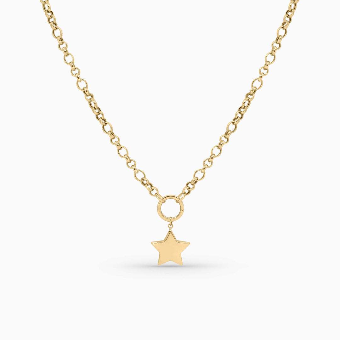 Gold necklace with a star pendant on a white background