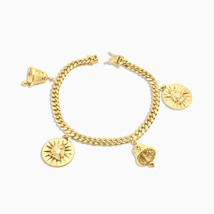 Gold bracelet with charms on a white background