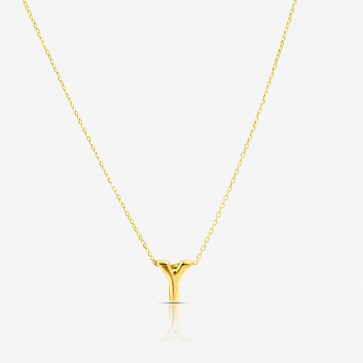 Gold necklace with a unique pendant on a white background